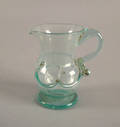 Pale aqua type one lily pad cream pitcher with applied circular foot ca 1835