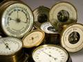 Seven Aneroid Barometers and a Thermometer