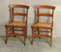 Pair of tiger maple saber leg chairs