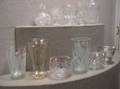 Eleven Assorted Colorless Glass Vases