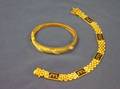 Gold and Diamond Bangle Bracelet and a Gold and Black Enamel Link Bracelet