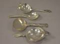 Sterling Silver Georg Jensen Cactus Tea Strainer and Serving Spoon a Gorham Jam Spoon and an English Tea Strainer