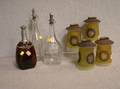 Four Frosted and Cut Glass Lamp Shades and Three Clear Glass Decanters