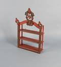Carved and painted hanging shelf