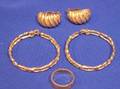 Two Paris of Gold Earrings and a Gold Band