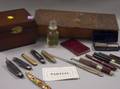 Group of Pocketknives Pens Wallets Cases One Wooden Box Etc