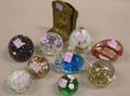 Nine Glass Paperweights and a Pair of Cast Brass Bookends
