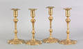 Four nearly identical Queen Anne brass candlesticks ca 1740