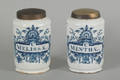 Two Delft blue and white drug jars with brass lids ca 1740