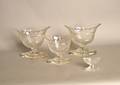 Set of four engraved colorless glass footed bowls