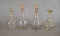 Four colorless glass decanters 19th c