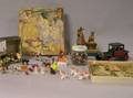 Group of Miniature Figures a Jar of Clay Marbles Two Puzzles Lithograph Pull Toy and Tin Car