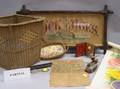 Two Wicker Baskets a Sampler Two Wooden Birds Four Pieces of Rockingham Flow Blue Bed Pan Transferware and Prints