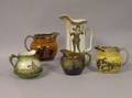 Four English Ceramic Transfer Decorated Jugs and a 1906 Buffalo Pottery Robin Hood Transfer Decorated Jug
