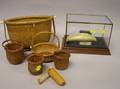Two Nantucket Woven Baskets and Four Miniature Nantucket Baskets with a Scrimshaw Sailin Susan Decorated Resin Whales Tooth