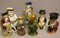 Seven Assorted Glazed and Decorated Ceramic Toby Jugs