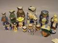 Sixteen Assorted Ceramic Toby Jugs Two Pepper Pots and a Tea and a Jam Pot