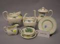 Twentysix Piece Spode Green and White Floral Decorated Partial Tea Set and a Set of Eleven George Jones Floral Decorated Plates