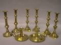 Four Pairs of Brass Candlesticks