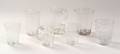 Seven Colorless Blown Glass Drinking Vessels