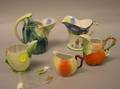 Five Porcelain Fruitform and Decorated Creamers