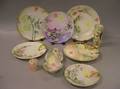 Nine Pieces of Limoges and Bavarian Handpainted Floral Decorated Porcelain