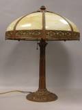 Eight Bent Panel Caramel Slag Glass and Painted Cast Metal Table Lamp