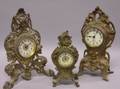 Three Rococostyle Gilt Cast Metal Mantel Timepieces