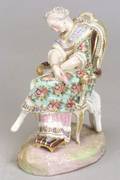 Porcelain Figurine of a Seated Woman