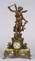 French Patinated Metal and Onyx Figural Mantel Clock