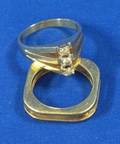 Gold and ThreeDiamond Ring and a Square Band