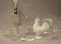 Eight Pieces of Colorless Pressed Pattern Glass Four Clear Glass Fluid Lamps a Milk Glass Rooster and a Rose Decorated Plate