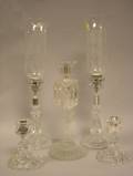 Two Pairs of Baccarat Colorless Crystal Candlesticks and a Baccarat Frosted Colorless Crystal Figural Candlestick
