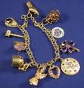 14kt Gold and Gemset Charm Bracelet