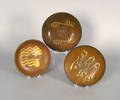Three slip decorated redware plates