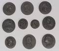 Ten Assorted Black Basalt Portrait Medallions