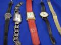 Three Womans 14kt Gold Movado Wristwatches Marla Buck Sterling Wristwatch and a Guess Wristwatch