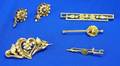 Three Gold Bar Pins a Pair of Earrings and a Pin