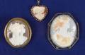 Two Carved Shell Cameo Brooches and a Pendant