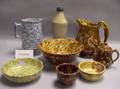 Seven Pieces of Rockingham Glazed Tableware a Spongeware Pitcher and Bowl and Two Stoneware Bottles