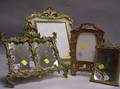 Four Cast Giltmetal and Brass Table Frames