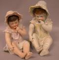 Two Large Bisque Piano Babies with Molded Lacy Hats