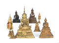 Eight cast Buddha figures and temple gods