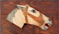 Carved horsehead plaque