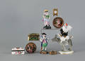 Group of decorative table objects to include three porcelain figures