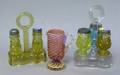 Two Pressed Colored Glass Caster Sets and a Vassa Murrihina Blown Glass Creamer