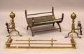 Pair of Brass Andirons and a Fender and Wood Basket