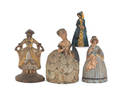 Four cast iron maiden doorstops