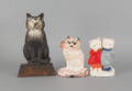 Three cast iron cat doorstops