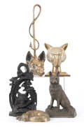 Three brass fox doorstops